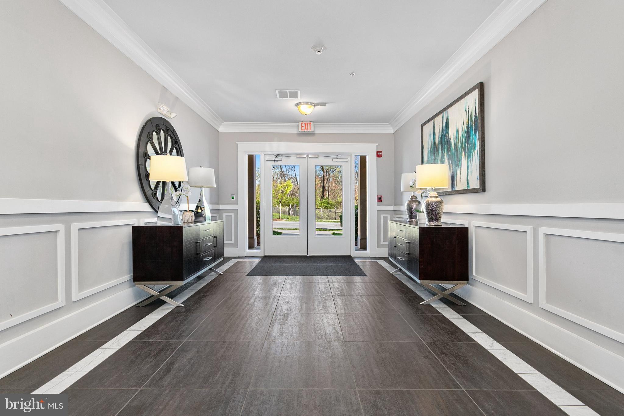 3825 Doc Berlin Drive, Unit 25 Silver Spring, MD 20906 - Photo 3 of 41 a view of a room with wooden floor fireplace and windows