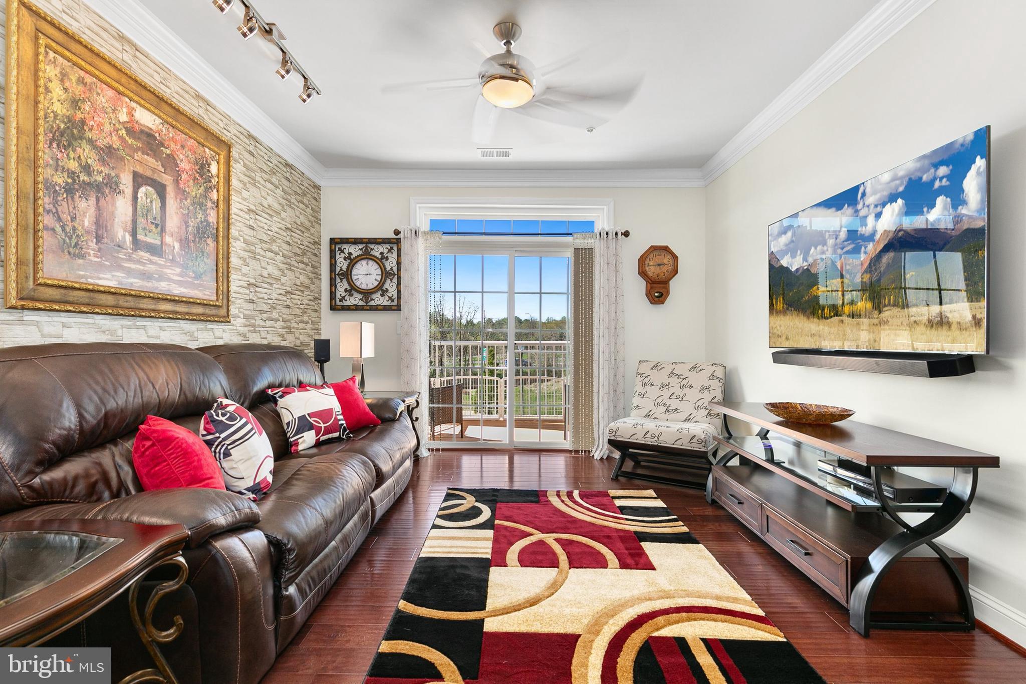 3825 Doc Berlin Drive, Unit 25 Silver Spring, MD 20906 - Photo 7 of 41 a living room with furniture and a flat screen tv