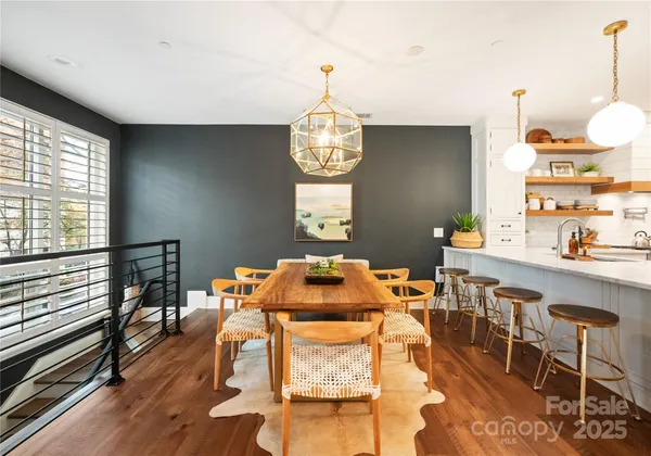 a kitchen with a table and chairs in it