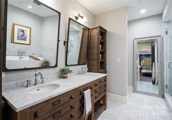 a bathroom with double sink and a mirror