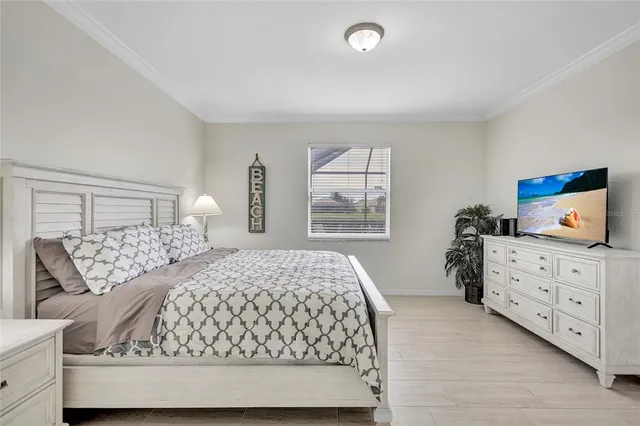 a bedroom with a large bed and furniture