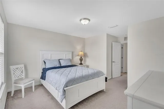 an aerial view of a swimming pool and mountain view in back