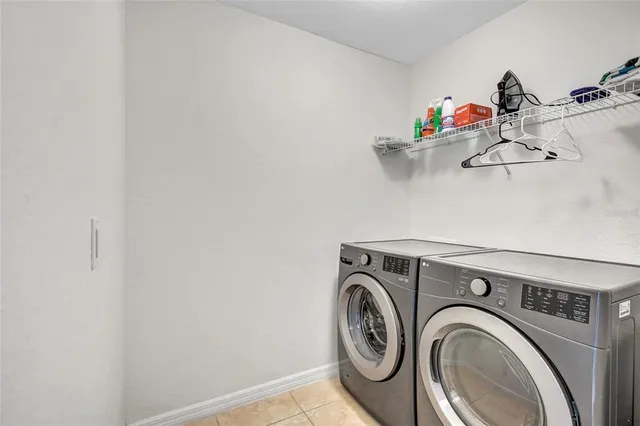 a view of a swimming pool and lounge chairs