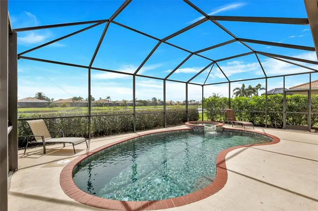 a view of a lake with houses in background