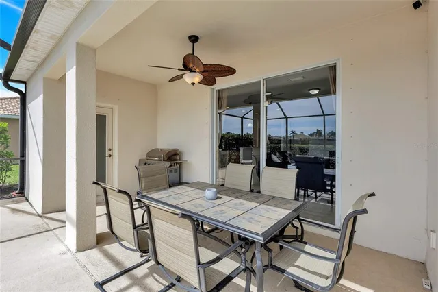a living room with furniture and a kitchen view