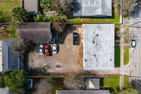 an aerial view of a house with outdoor space