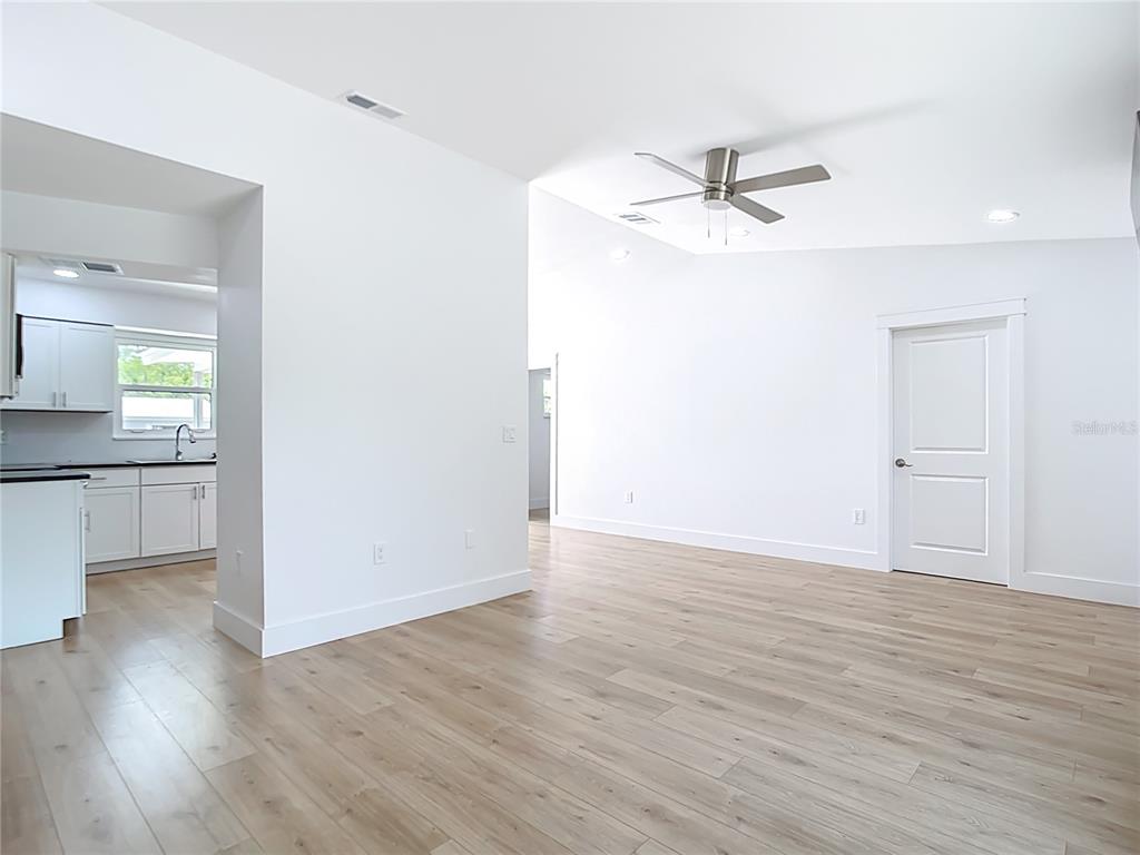 7341 Hart Street Englewood, FL 34224 - Photo 15 of 39 wooden floor in an empty room with a window