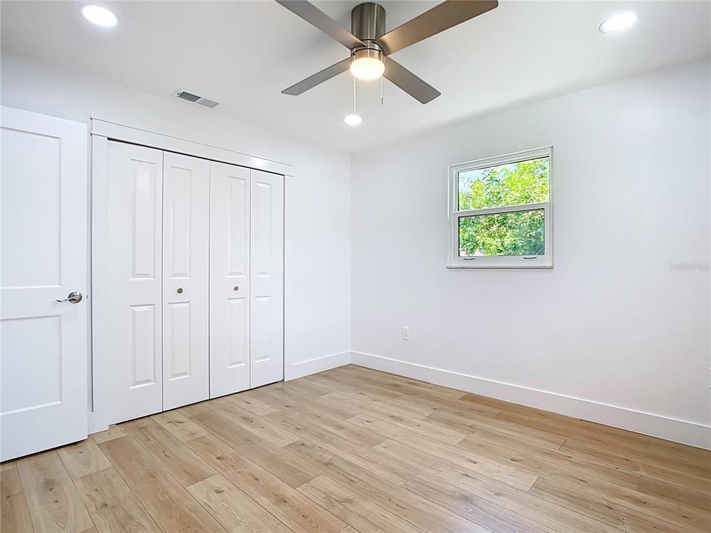 7341 Hart Street Englewood, FL 34224 - Photo 27 of 39 wooden floor in an empty room with a window