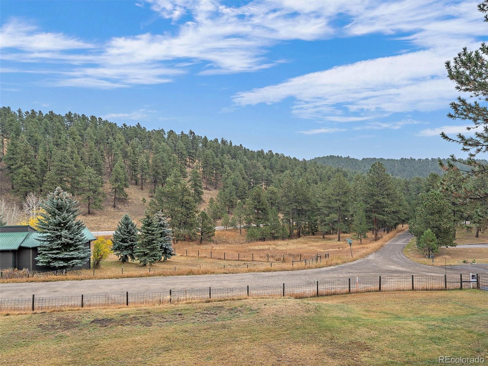 27422 Pine Valley Drive Evergreen, CO 80439 - Photo 14 of 42 a view of ocean with green space