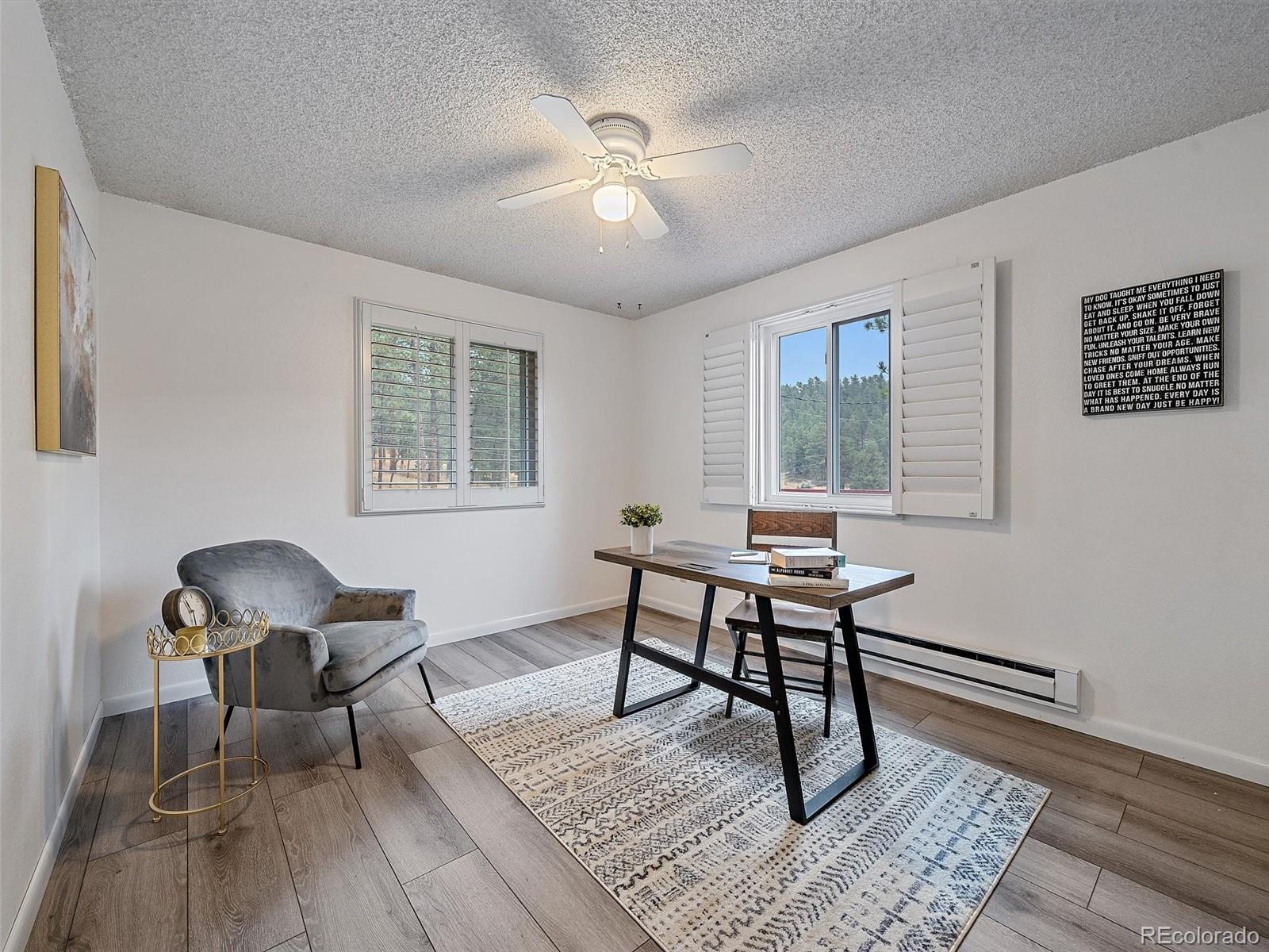 27422 Pine Valley Drive Evergreen, CO 80439 - Photo 18 of 42 a workspace with wooden floor