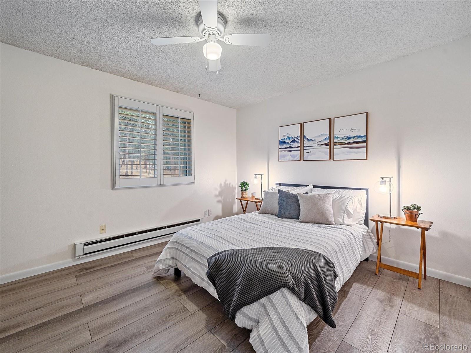 27422 Pine Valley Drive Evergreen, CO 80439 - Photo 19 of 42 a bedroom with a bed and a chandelier