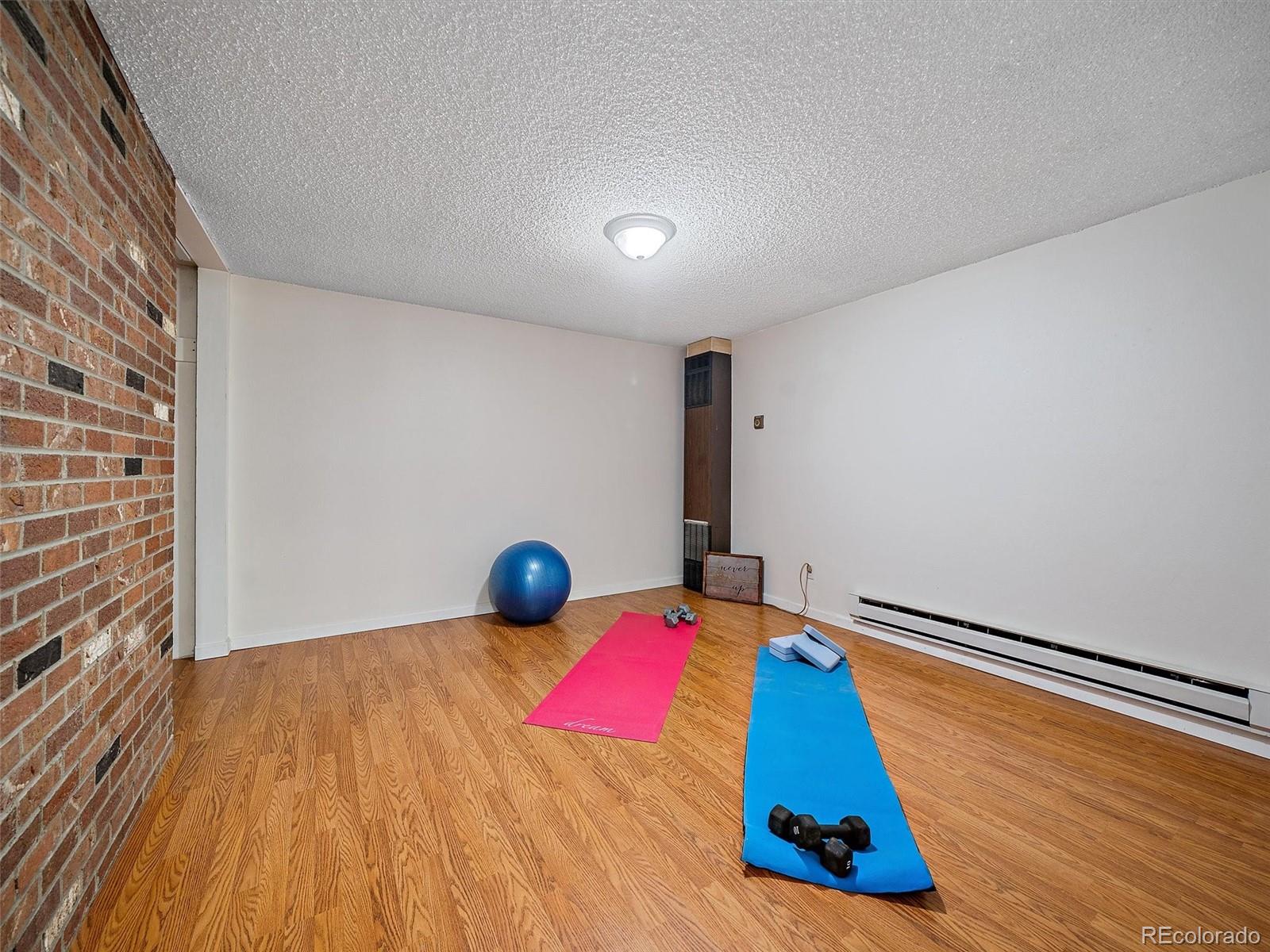 27422 Pine Valley Drive Evergreen, CO 80439 - Photo 26 of 42 a bedroom with a bed and a night stand