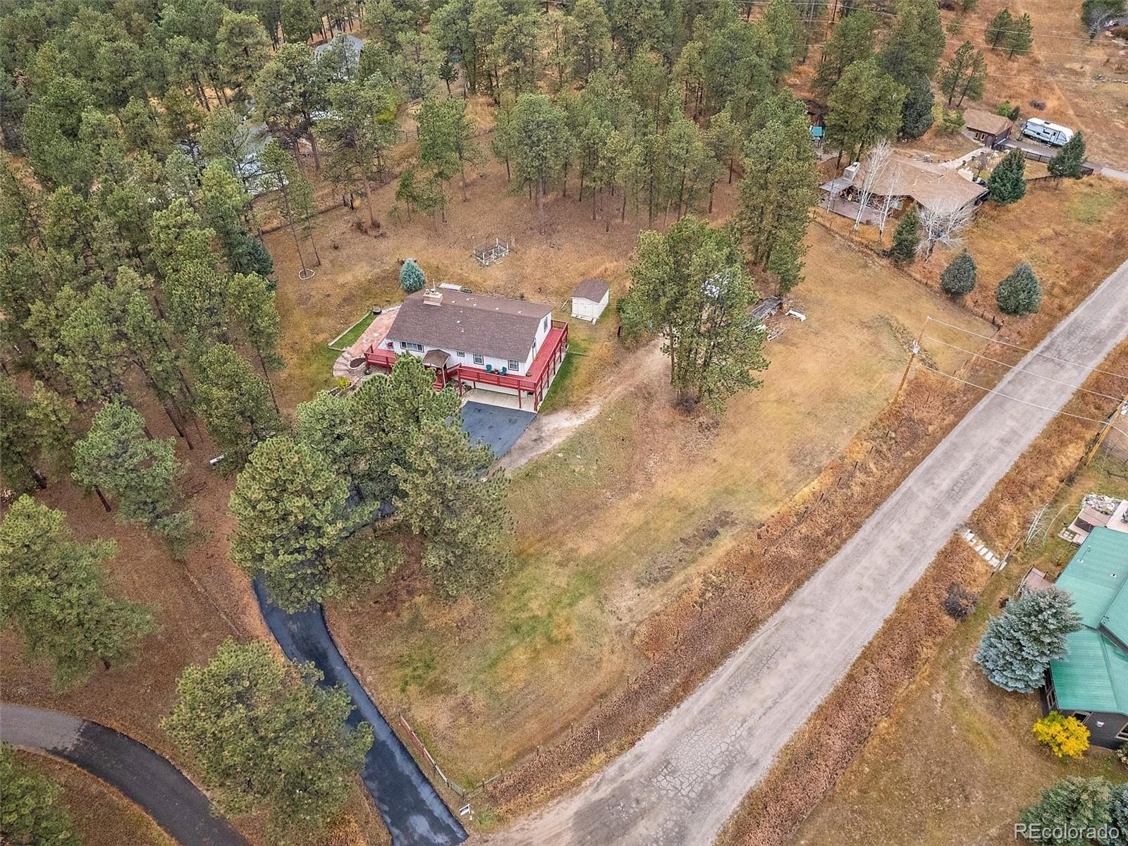 27422 Pine Valley Drive Evergreen, CO 80439 - Photo 33 of 42 a view of a yard with an outdoor space