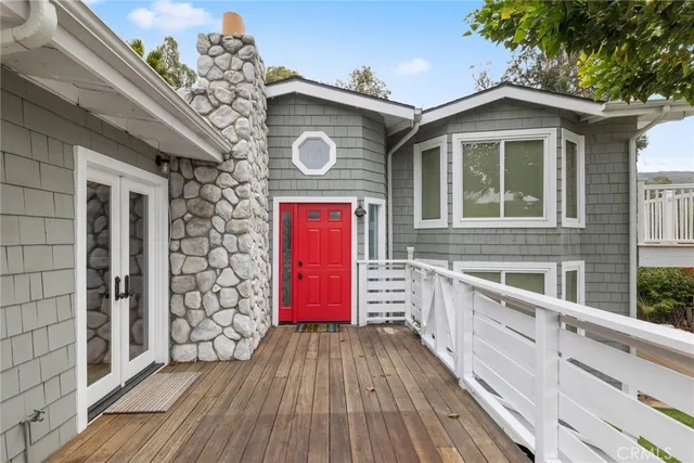 a view of brick house with a large window