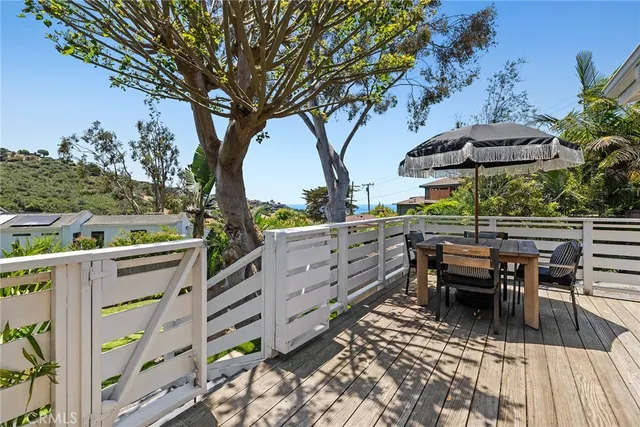 a view of a chairs and table in the patio