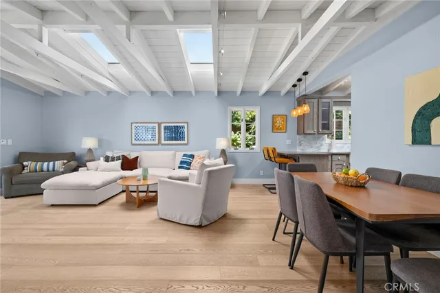 a living room with fireplace furniture and a wooden floor