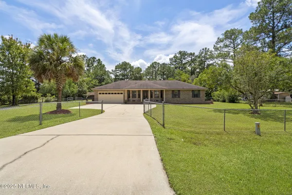 a view of a house with a big yard