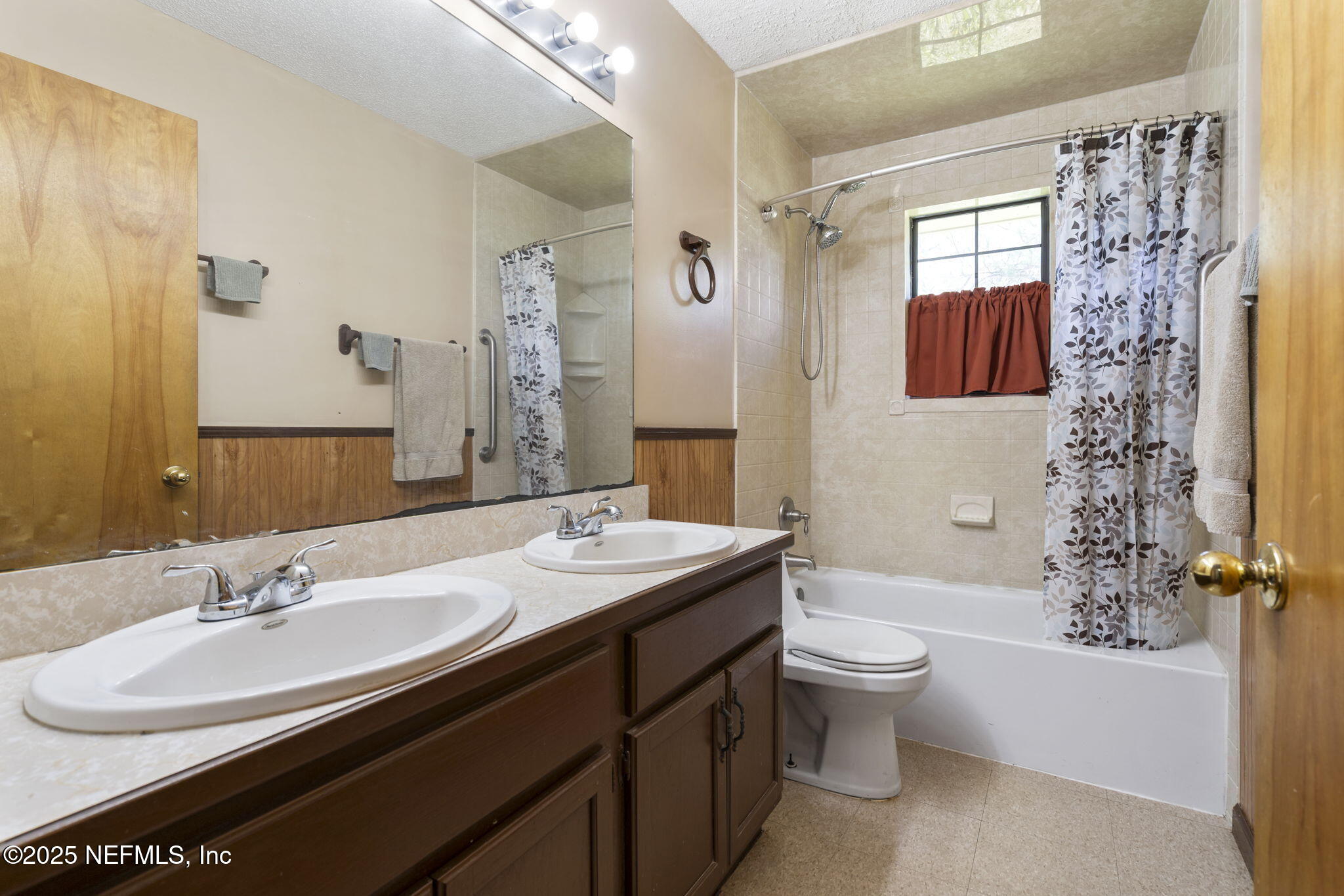 54230 Heller Road Callahan, FL 32011 - Photo 22 of 37 a bathroom with a granite countertop sink toilet and shower