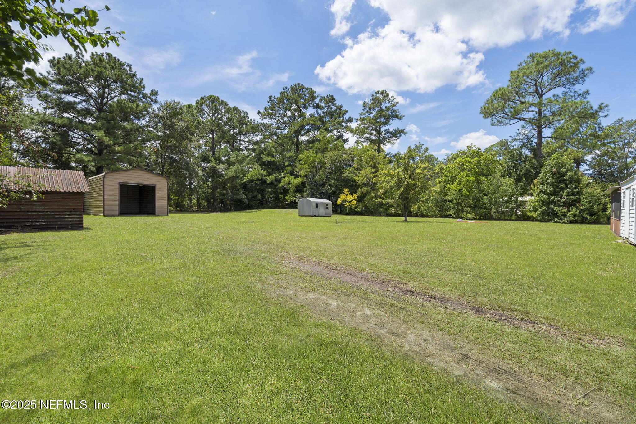 54230 Heller Road Callahan, FL 32011 - Photo 31 of 37 a view of a garden with a house