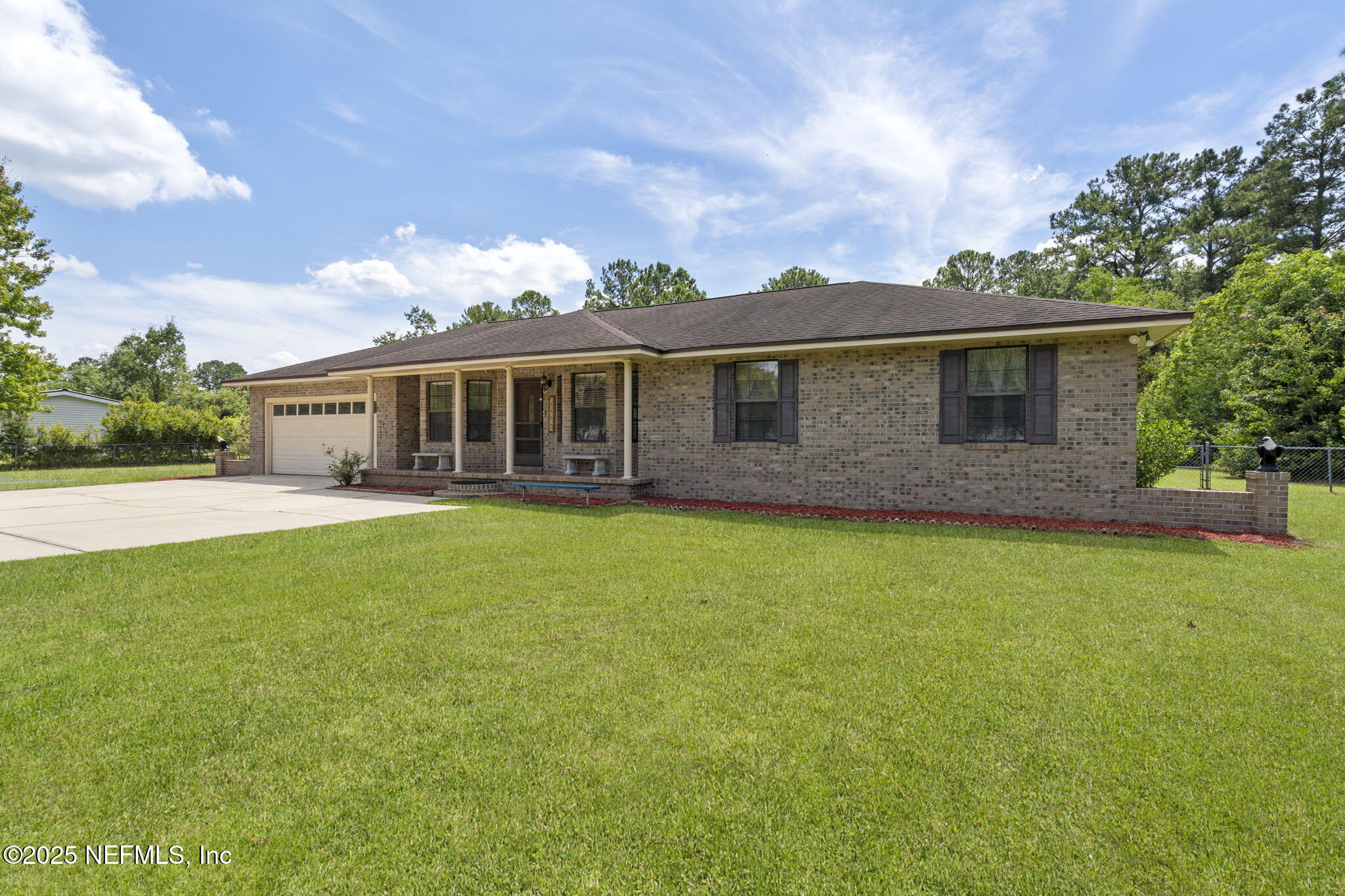 54230 Heller Road Callahan, FL 32011 - Photo 7 of 37 a front view of house with yard and balcony
