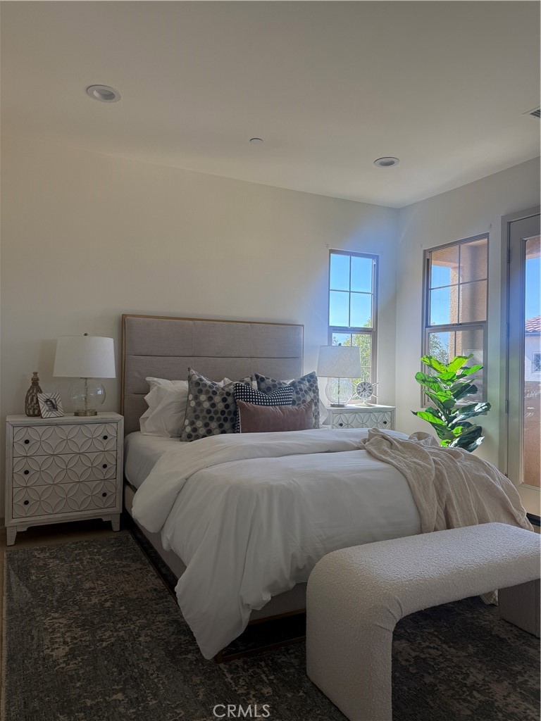 87 Evening Sun Irvine, CA 92620 - Photo 16 of 29 a bedroom with a bed and a dresser