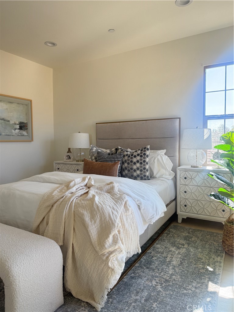 87 Evening Sun Irvine, CA 92620 - Photo 18 of 29 a bedroom with a bed and window