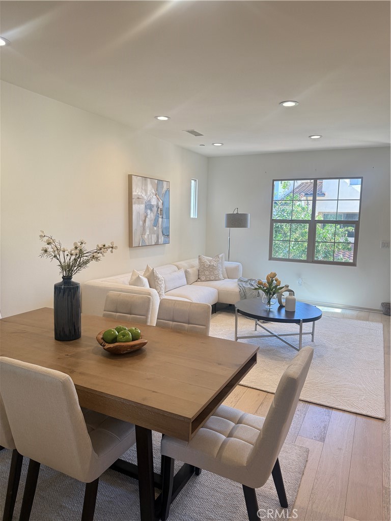 87 Evening Sun Irvine, CA 92620 - Photo 10 of 29 a living room with furniture a window and a table