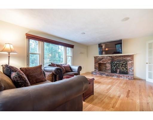 119 Rattlesnake Hill Road Andover, MA 01810 - Photo 15 of 30 a living room with furniture and a fireplace