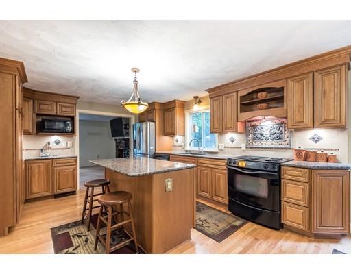 119 Rattlesnake Hill Road Andover, MA 01810 - Photo 4 of 30 a kitchen with stainless steel appliances granite countertop a stove top oven a sink a counter space and cabinets