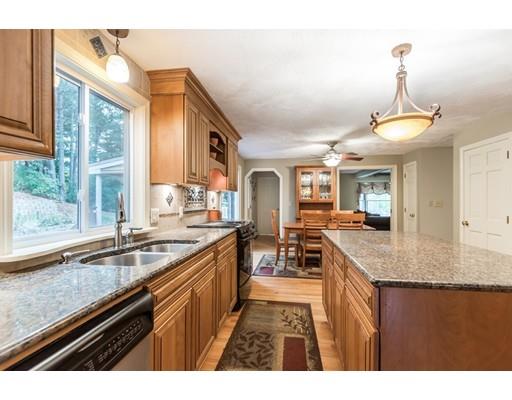 119 Rattlesnake Hill Road Andover, MA 01810 - Photo 8 of 30 a kitchen with granite countertop a sink and stove