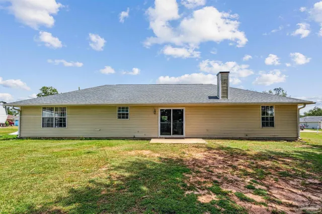 a house with yard in front of it