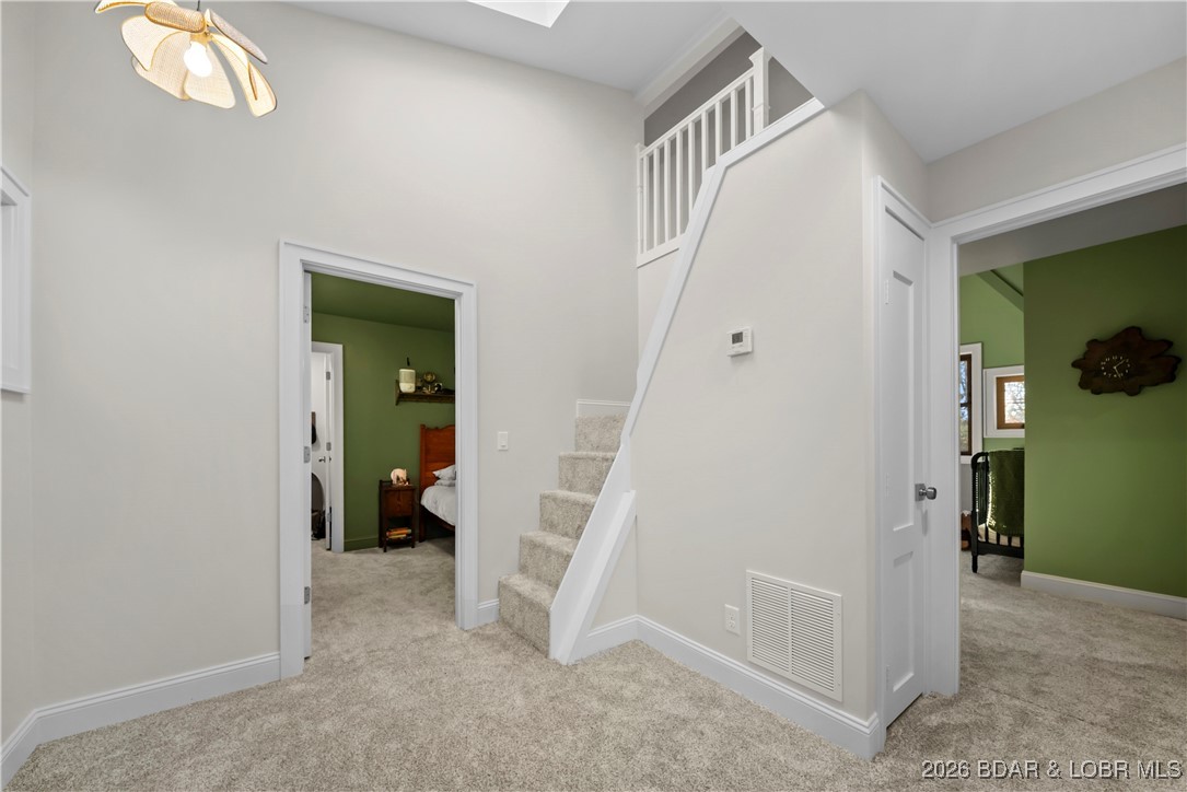 21255 Lark Road Lebanon, MO 65536 - Photo 30 of 75 Upper Level Landing Area/Stairs to Loft Space