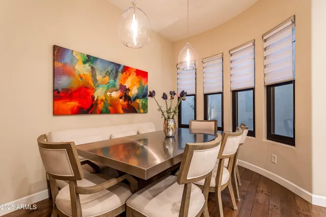a spacious en suite bathroom with a granite countertop sink mirror and bathtub