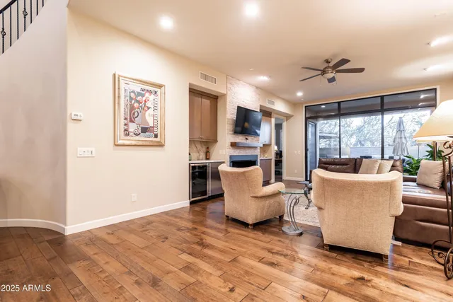 a view of a balcony with chair and wooden floor