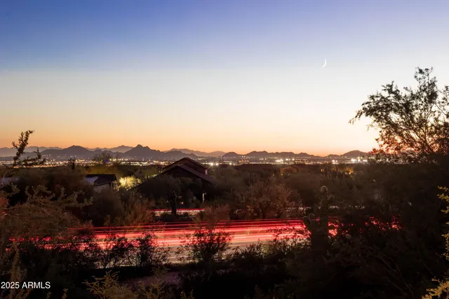 a living room with furniture a rug and a fireplace