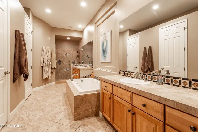 a view of a patio with a table and chairs and potted plants