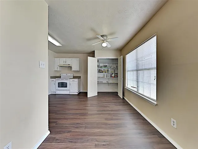 a view of a kitchen with electric appliances