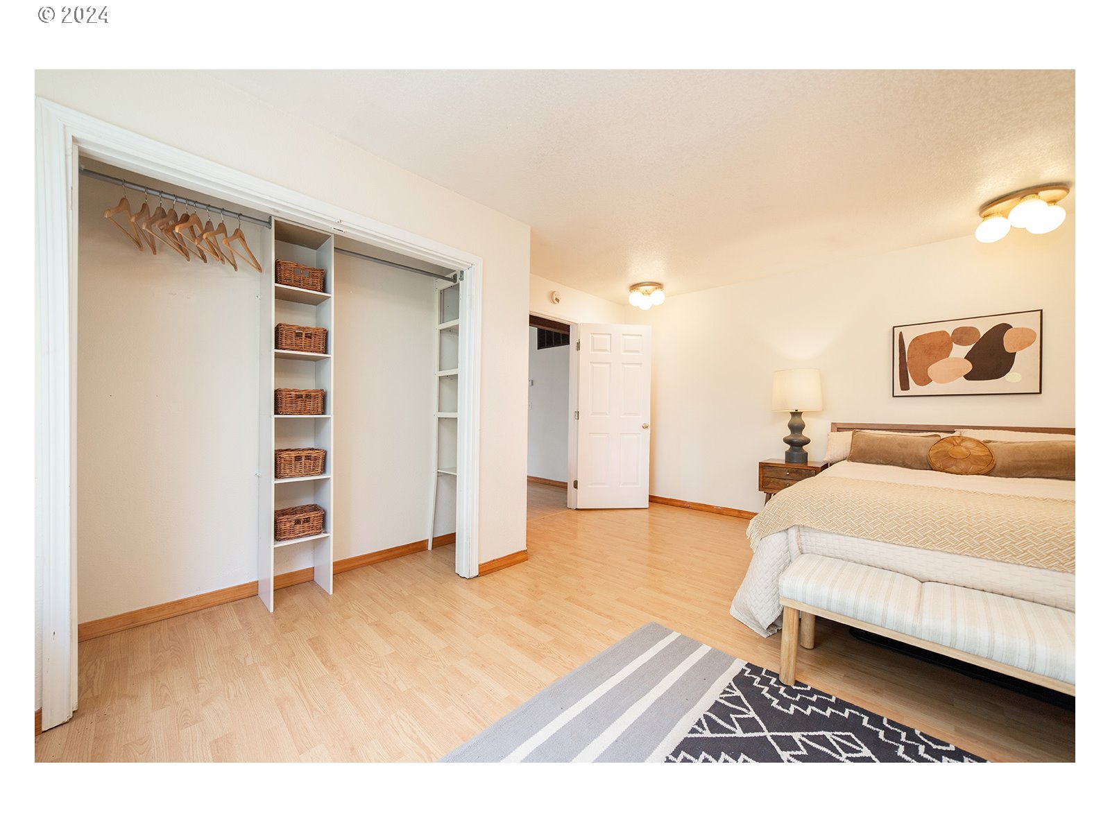 8767 Northwest Springville Road Portland, OR 97231 - Photo 13 of 47 a spacious bedroom with a bed and a view of bathroom