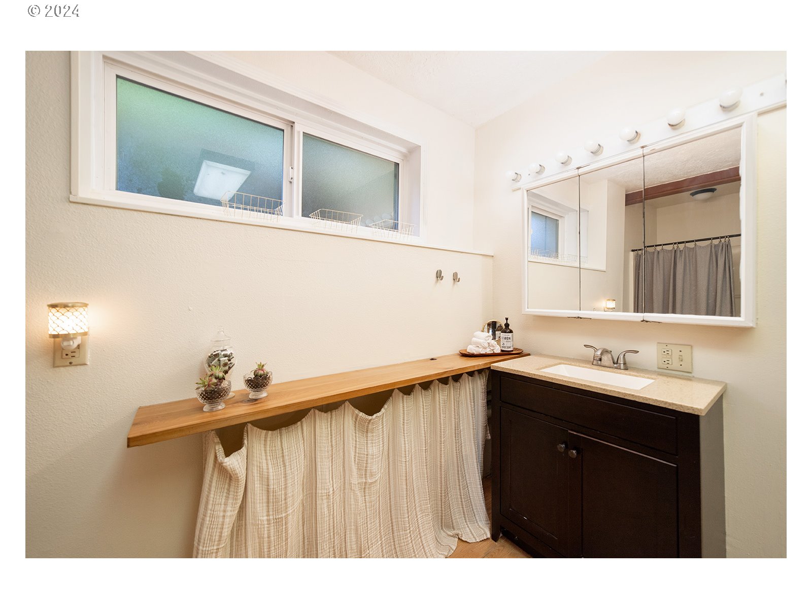 8767 Northwest Springville Road Portland, OR 97231 - Photo 16 of 47 a kitchen with a sink and cabinets