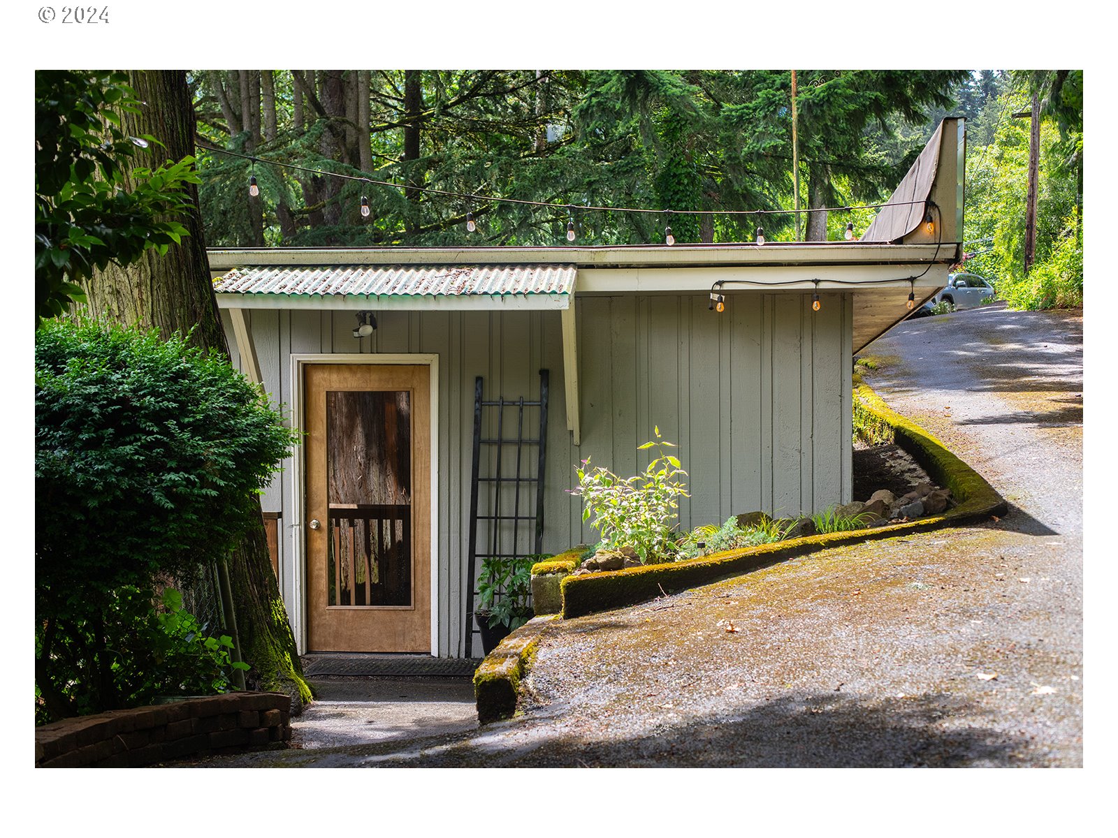 8767 Northwest Springville Road Portland, OR 97231 - Photo 19 of 47 a view of a porch with a yard
