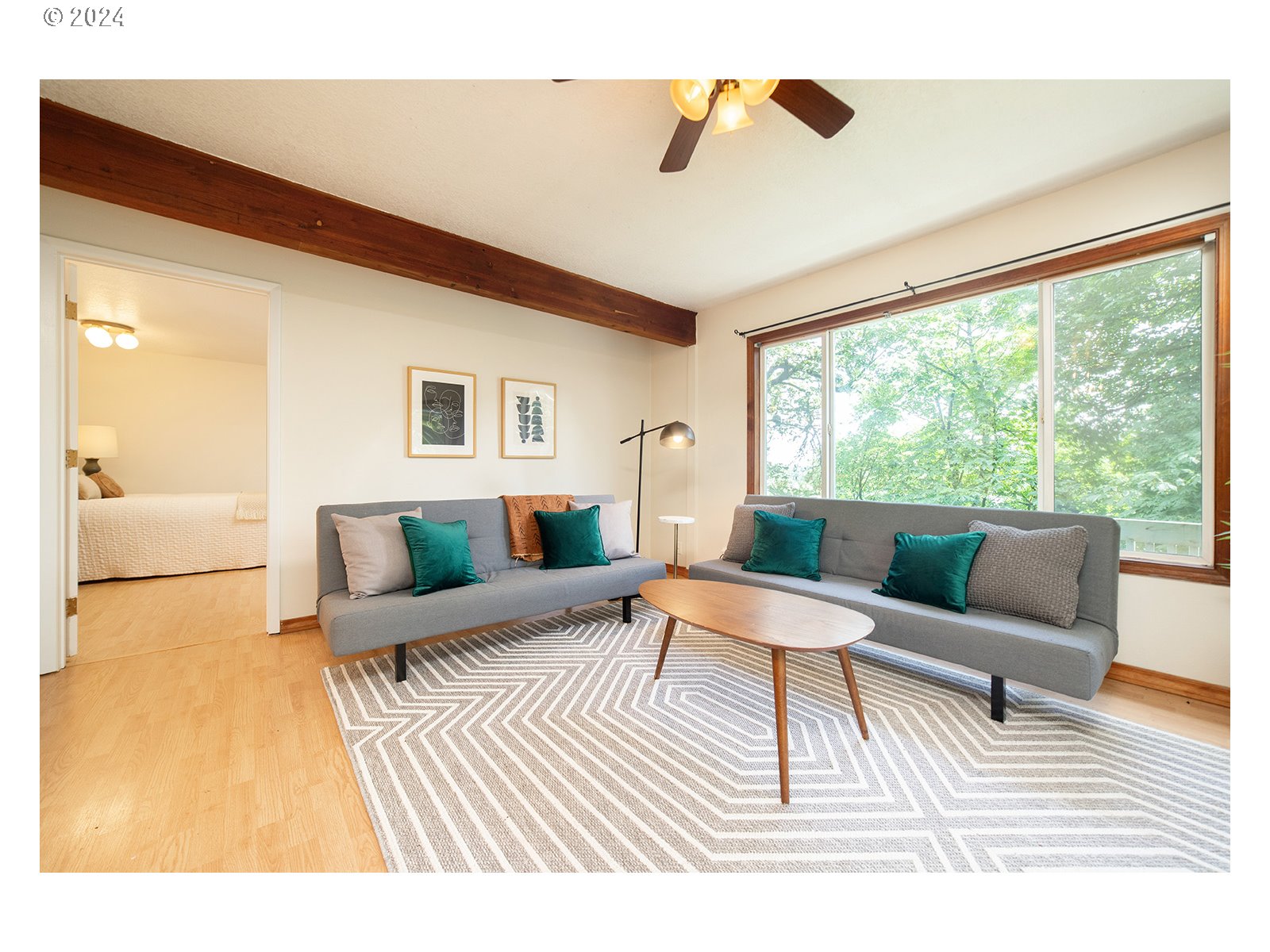 8767 Northwest Springville Road Portland, OR 97231 - Photo 2 of 47 a living room with furniture and a large window