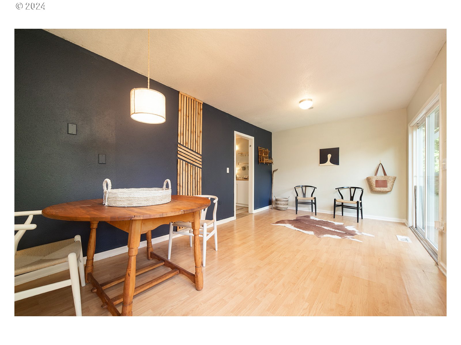 8767 Northwest Springville Road Portland, OR 97231 - Photo 23 of 47 a dining room with a table and chairs