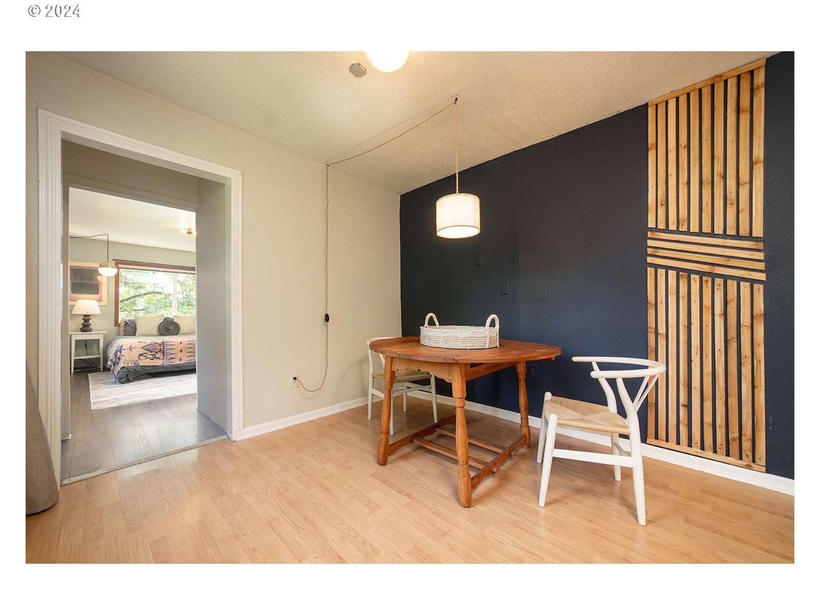 8767 Northwest Springville Road Portland, OR 97231 - Photo 25 of 47 a view of a dining room with furniture and wooden floor
