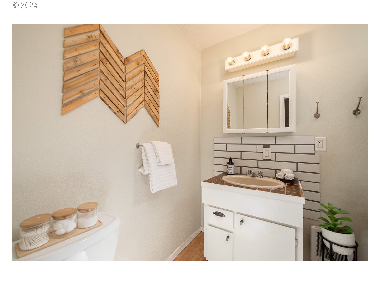 8767 Northwest Springville Road Portland, OR 97231 - Photo 30 of 47 a bathroom with a sink and a mirror