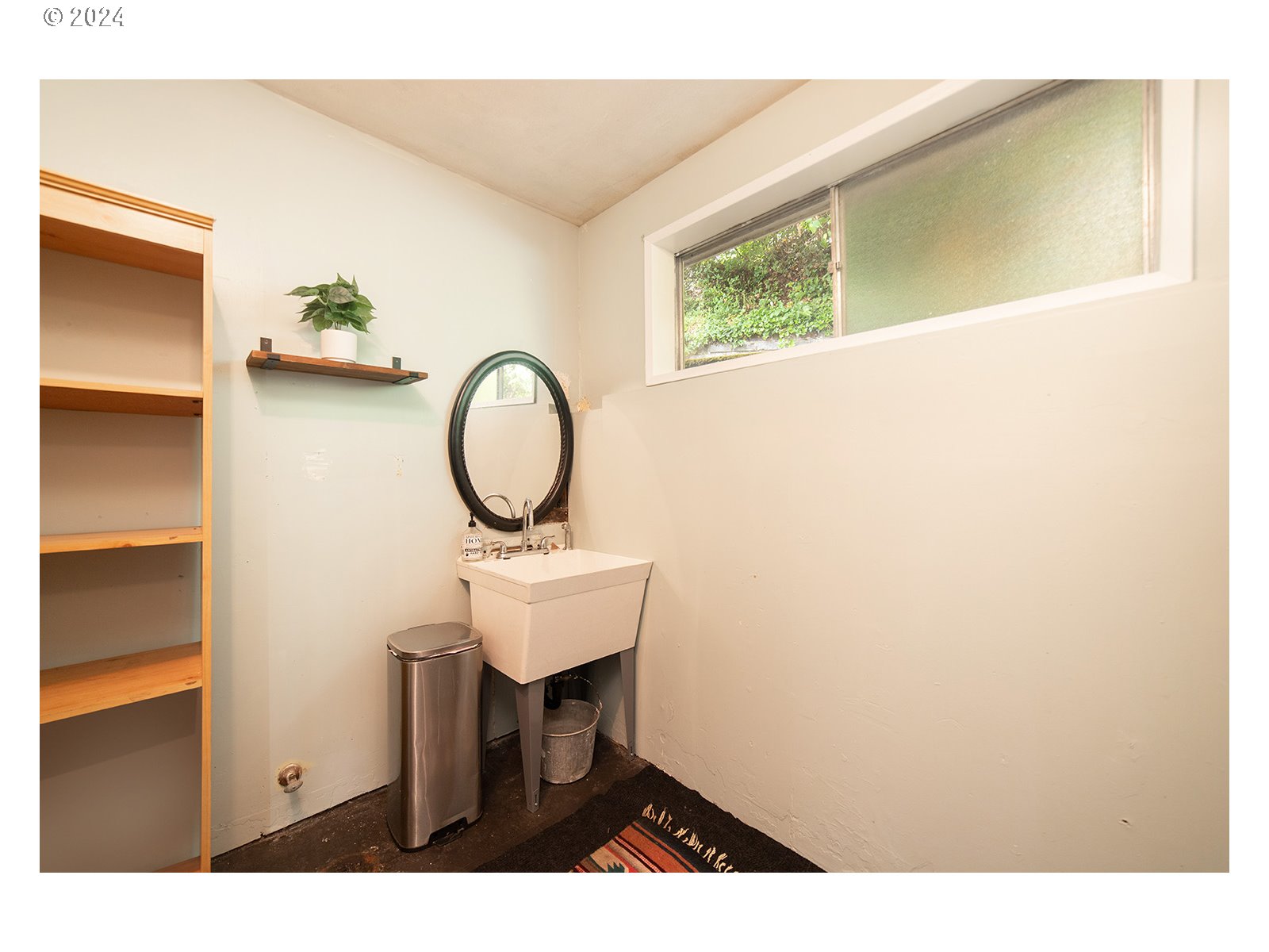 8767 Northwest Springville Road Portland, OR 97231 - Photo 34 of 47 a bathroom with a sink and a mirror