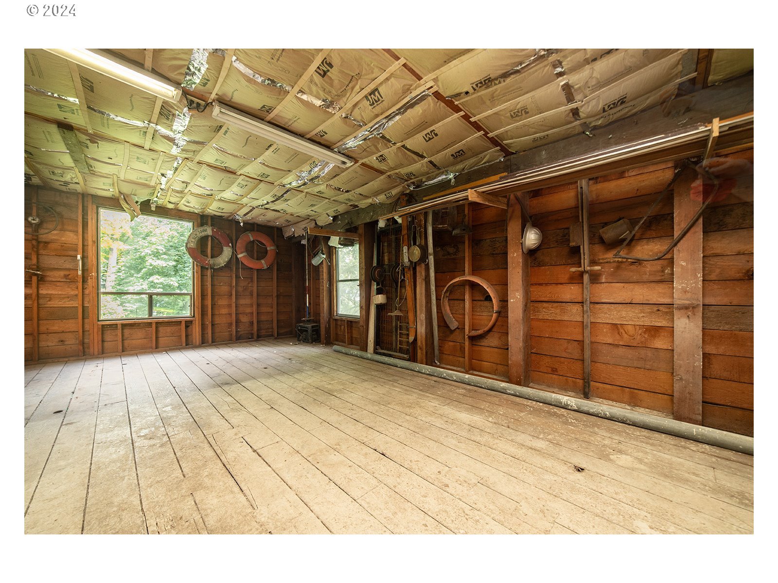 8767 Northwest Springville Road Portland, OR 97231 - Photo 41 of 47 a view of a room with wooden walls