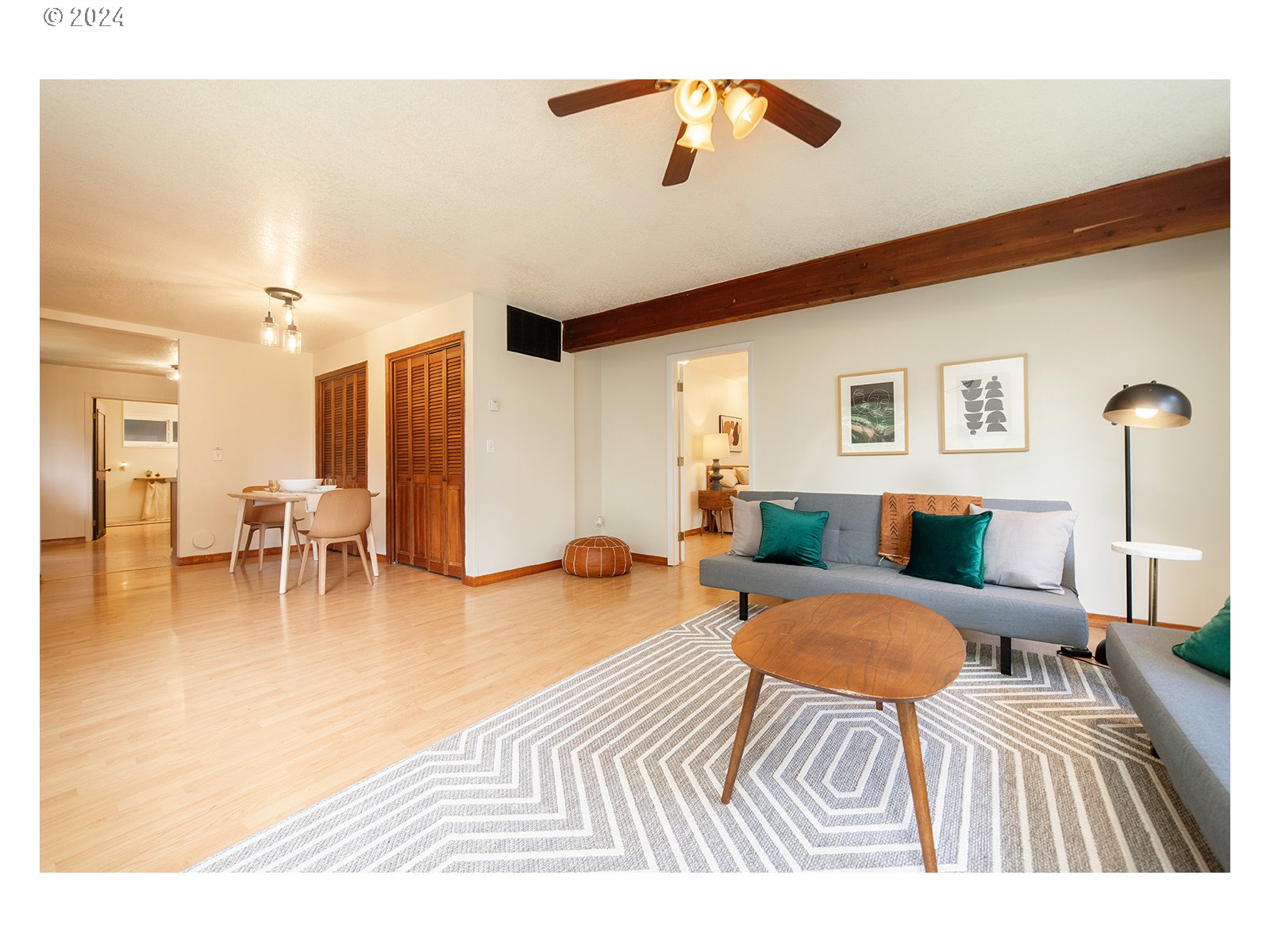 8767 Northwest Springville Road Portland, OR 97231 - Photo 5 of 47 a bedroom with furniture and a wooden floor