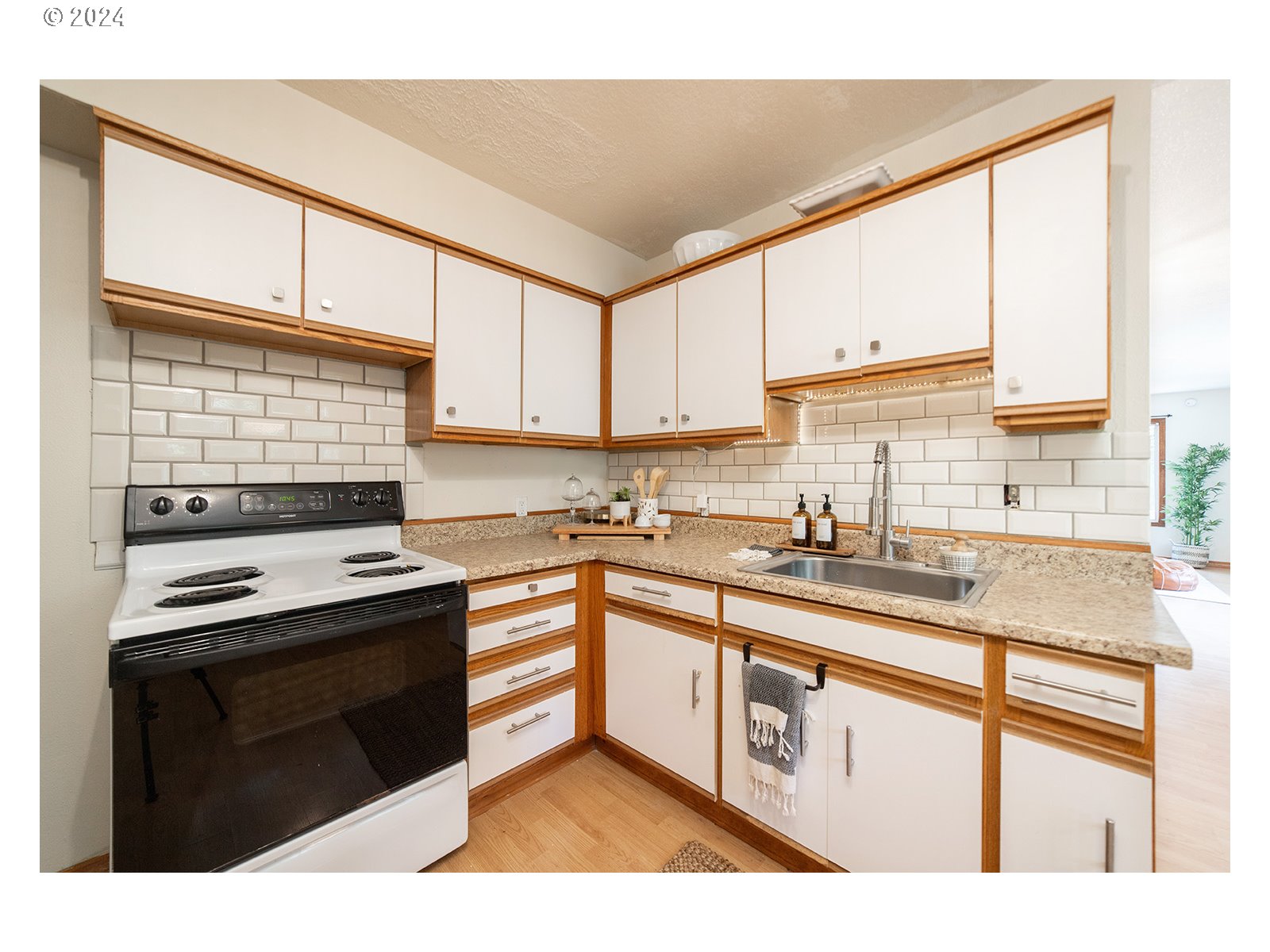 8767 Northwest Springville Road Portland, OR 97231 - Photo 8 of 47 a kitchen with stainless steel appliances granite countertop a stove a sink and a microwave