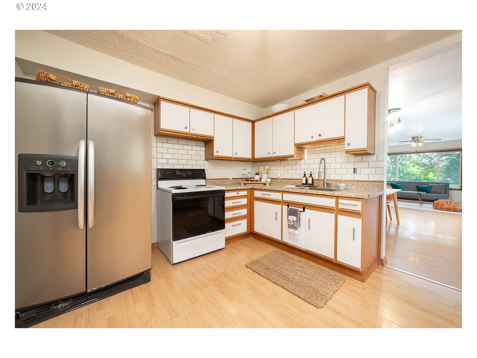 8767 Northwest Springville Road Portland, OR 97231 - Photo 9 of 47 a kitchen with stainless steel appliances granite countertop a stove a sink and a refrigerator