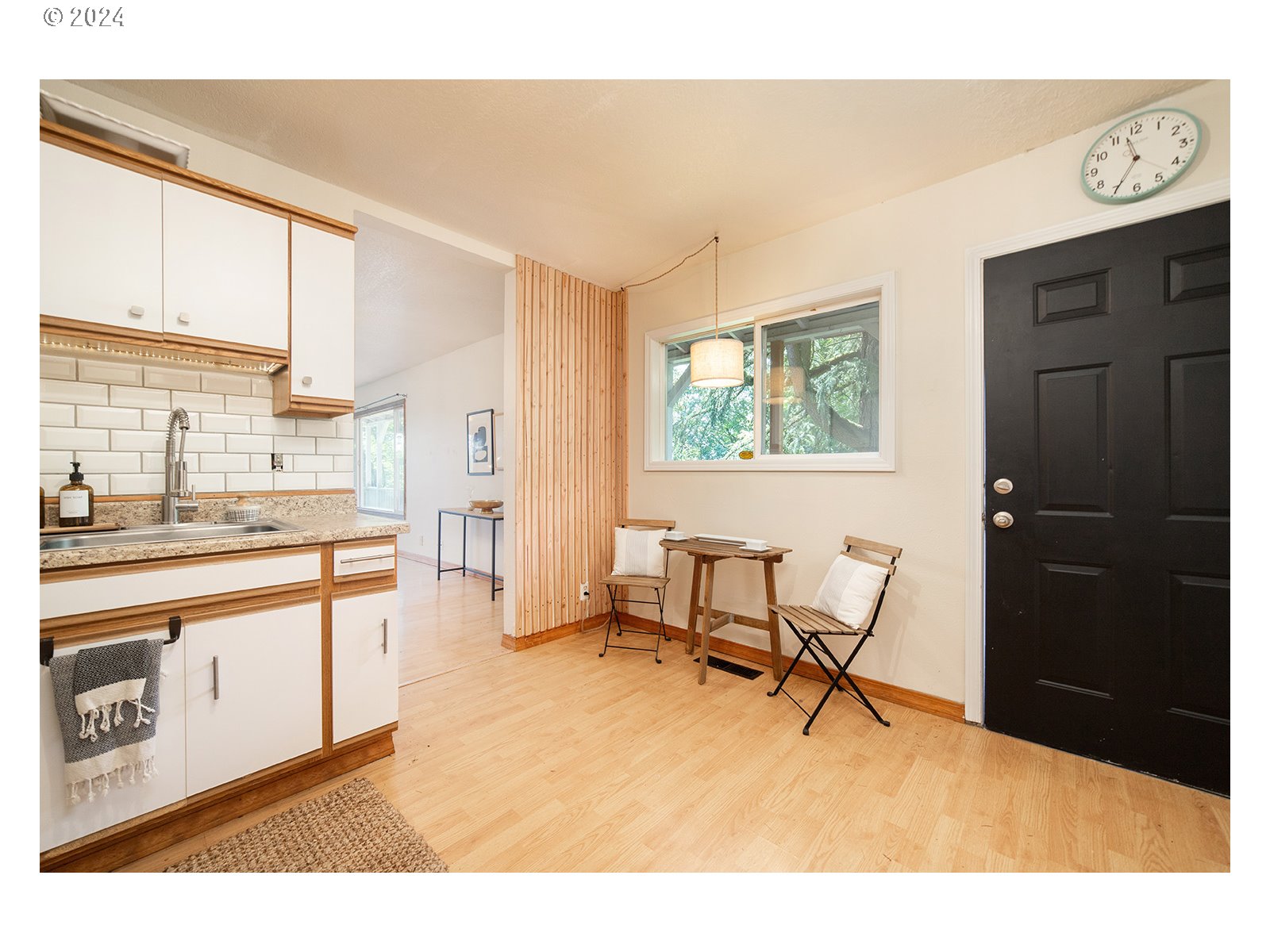 8767 Northwest Springville Road Portland, OR 97231 - Photo 10 of 47 a living room with stainless steel appliances kitchen island granite countertop furniture and a large window